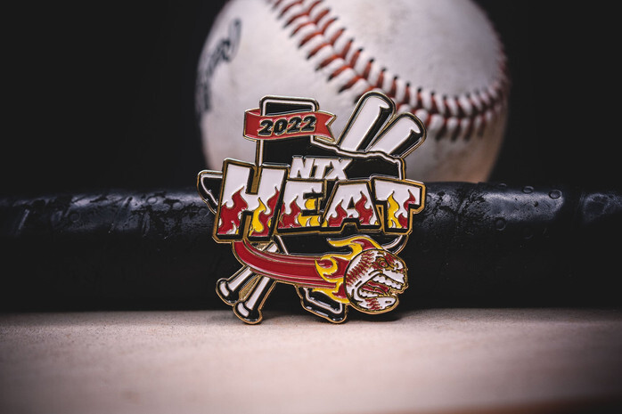 NTX Heat 2022 baseball trading pin with flames and crossed bats